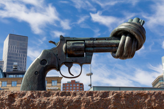 Malmo, Sweden: April 20, 2019: Statue of a gun with a knot as a non violence symbol, in the street of Malmo
