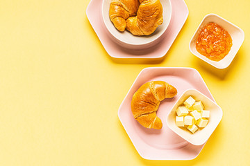 croissants for breakfast on a yellow background