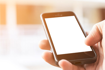 hand holding smartphone with blank screen, with sunlight.
