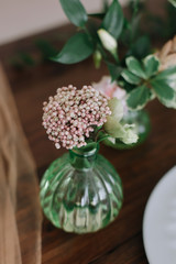 Place setting on wooden table.  Wedding inspiration. Wedding decorations for table in rustic style. 