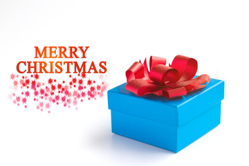 Blue gift box with red bow on white background. With Merry chrismas text.