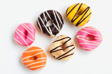 Donuts Set on White Background. You get different type of donuts, Top view.