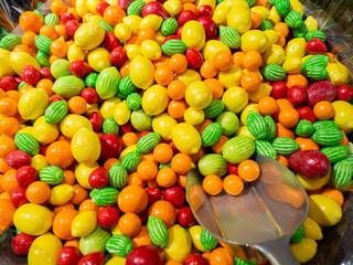 Close up of bowls filled with a large selection of different colored soft candies