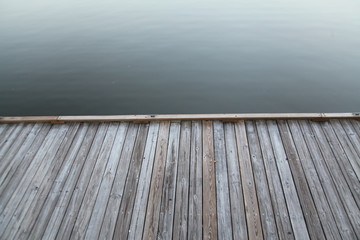 A rustic wooden deck on Rianhard Lake in Celebration Florida, USA.