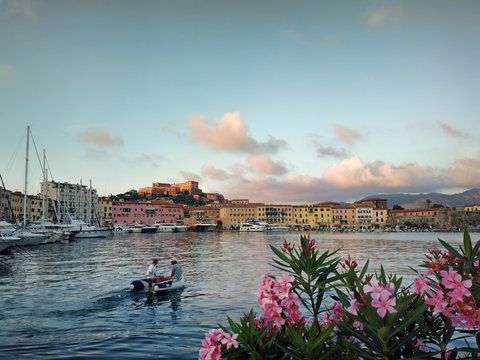 view of Portoferraio, Elba Island, Tuscan Archipelago. Italy.  VAcation. A small boat, the sea. Sunset. The old city