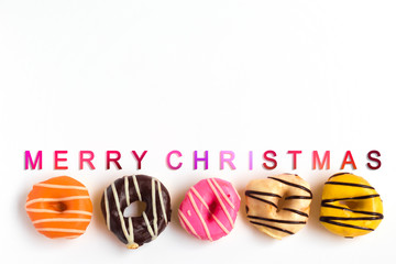 Donuts on white background wih christmas text, Celebration concept.