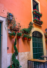 Fototapeta na wymiar Roman Restaurant Narrow Neighborhood Street Rome Italy