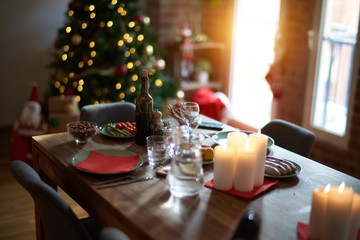 Nice home with tree, decorations and table with food prepared to celebrate Christmas.