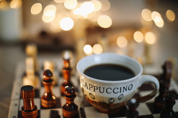 Part of chess table. chess pieces on a wooden chess board, top view. Leisure relax time or business strategy concept. Flat lay