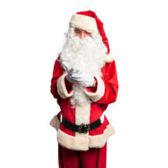 Middle age handsome man wearing Santa Claus costume and beard standing Suffering pain on hands and fingers, arthritis inflammation