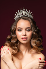 Beautiful portrait of young woman with perfect make-up, hairstyle, and nail design. Beauty contest. Crown on her head © Ксения Левашова