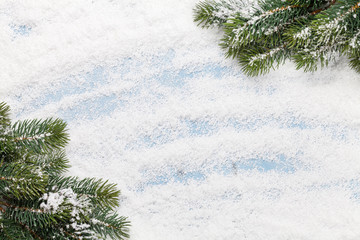 Christmas card with fir tree over snow