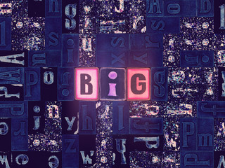 The word Big as neon glowing unique typeset symbols, luminous letters big