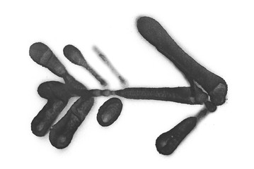 Graffiti arrow isolated on white background, clipping path, black spray stain