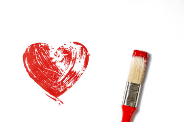 a red heart is drawn on a white piece of paper and a red brush is on the right