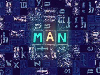 Word Man as glowing letter over dark background