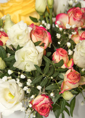 beautiful delicate floral bouquet with yellow pink shades on the background