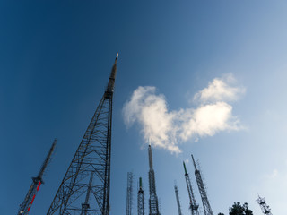 Television and radio transmitters extending into the blue sky