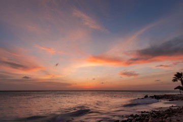 Naklejka na ściany i meble Amazing beauty colorful sunset on Caribbean. Aruba island. Unforgettable view. Amazing background.