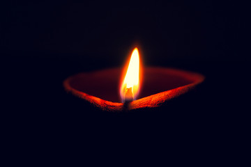 Diwali diya illuminating in the dark