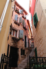 Romantic travel location, picturesque paved old street in the Old Town of Rovinj, Croatia. Europe.