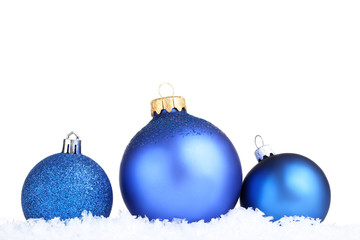 Christmas baubles with snow on white background