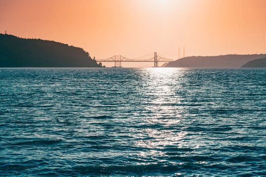 Reflection off the amazing Carquinez Strait with the Bridges in the background during sunset