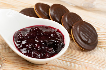 Round chocolate jaffa cake or biscuit cookie filled with natural jam