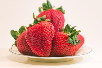 Strawberries on White Plate Closeup
