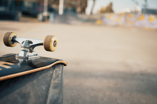 Close Up Of Skateboard Wheels In Concrete Skatepark On Warm Day