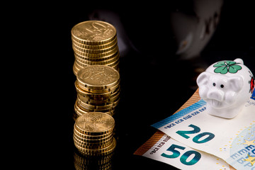 Euro coins in stack on black background