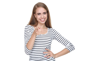 Young beautiful girl showing by finger on white background