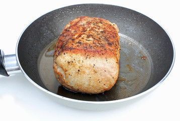 Browning Pork Roast in Skillet in preparation for Crockpot Pot Roast.