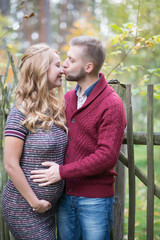 Fototapeta premium A portrait of young married couple expecting a baby