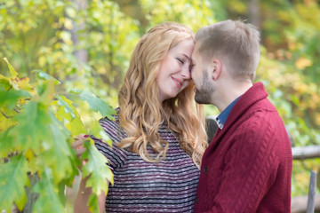 Fototapeta premium A portrait of young married couple expecting a baby