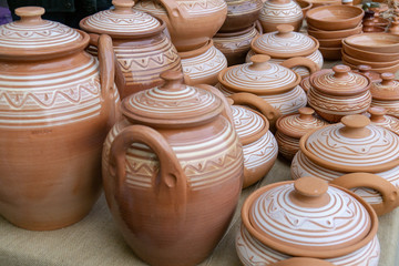 Fototapeta na wymiar The fair of folk craftsmen of pottery. Handmade clay pots