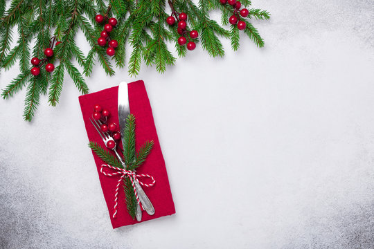 Christmas table setting with fir tree branch on stone background. Top view. Copy space - Image
