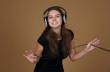 Happy girl in headphones, passionate about music