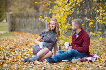 A portrait of young married couple expecting a baby