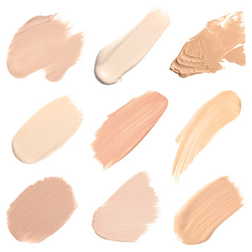 Set of different foundation shades on white background, top view