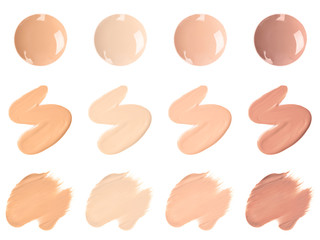 Set of different foundation shades on white background, top view