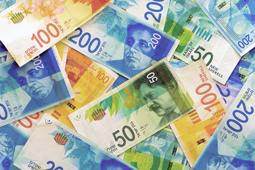 Israeli money stack of the new Israeli money bills (banknotes) of 50, 100 and 200 shekel. New Israeli Shekel series C.