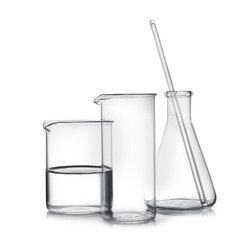 Laboratory glassware with liquid samples on white background
