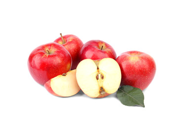 Ripe juicy red apples with leaf on white background