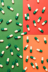 Capsule pills pattern on a colored background. Mock up for special offers as advertising, web background or other ideas. Medical, pharmacy and healthcare concept. Copy space. Empty place for logo.