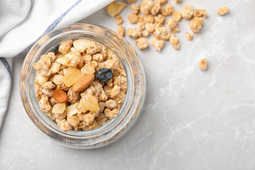 Tasty homemade granola on light table, top view with space for text. Healthy breakfast