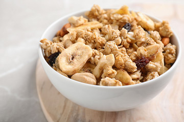 Tasty homemade granola on light table. Healthy breakfast