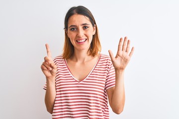 Beautiful redhead woman wearing casual striped red t-shirt over isolated background showing and pointing up with fingers number six while smiling confident and happy.