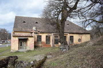 old abandoned wooden house in autumn