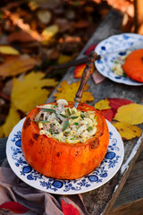 Pumpkin Stuffed with Pasta, Cheese and Meat. outdoor photo